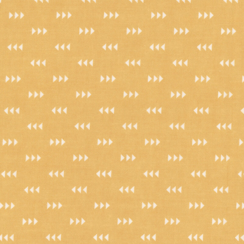 Golden yellow fabric featuring a pattern of white triangles