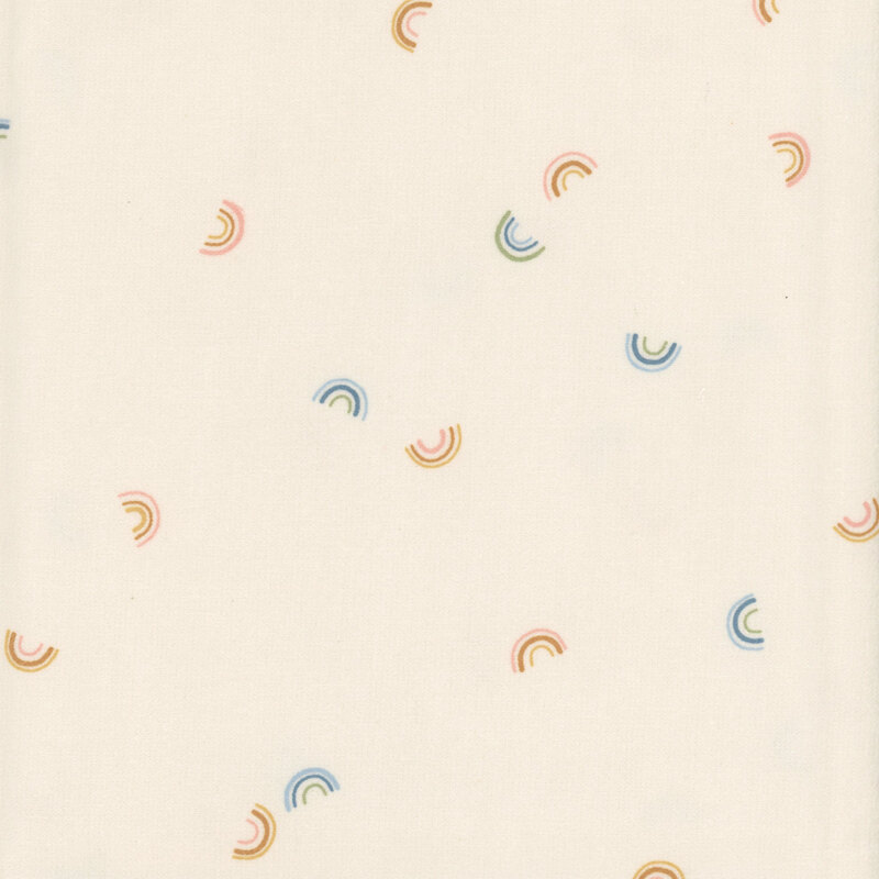 cream fabric tossed with small rainbows