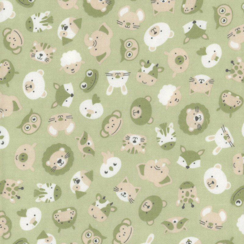 Pastel green fabric featuring tossed animals