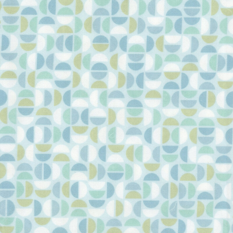 Light blue fabric featuring a geometric design of half circles in white and shades of blue and green