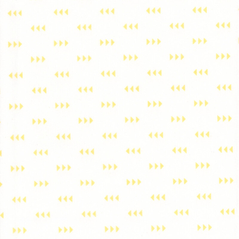 White fabric featuring a pattern of yellow triangles