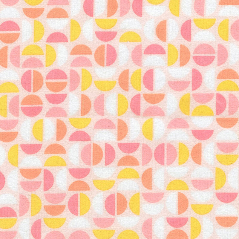 Light peach fabric featuring a geometric design of half circles in white, yellow, peach, and shades of pink