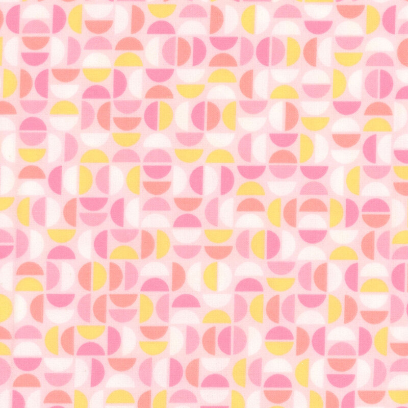 Light peach fabric featuring a geometric design of half circles in white, yellow, peach, and shades of pink