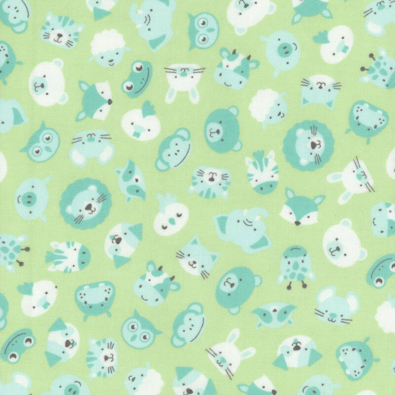 Sea foam green fabric featuring tossed animals