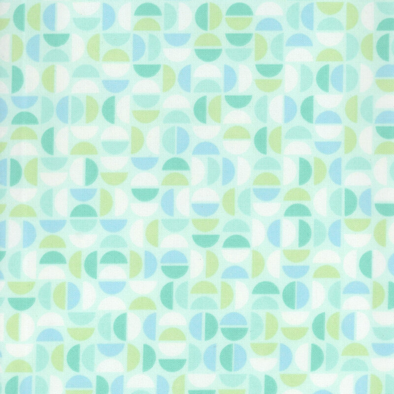 Light aquamarine fabric featuring a geometric design of half circles in white, blue, green, and turquoise