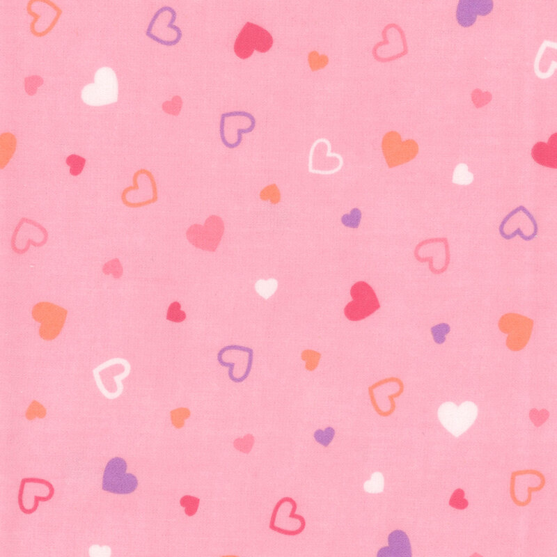 Pink fabric tossed with colored hearts