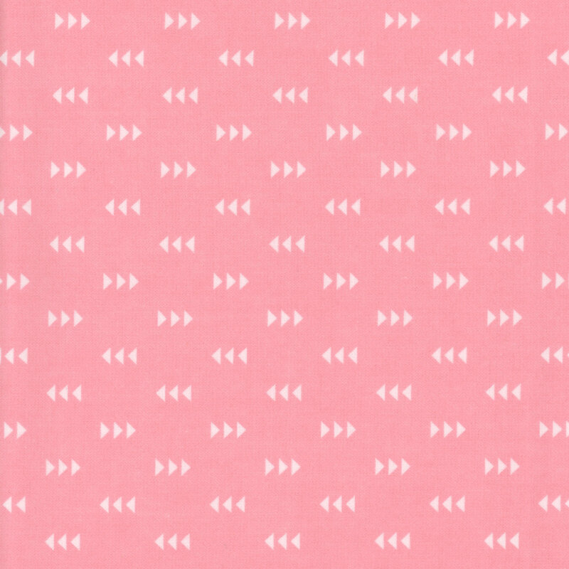 Pink fabric featuring a pattern of white triangles