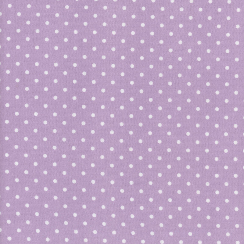 Pastel purple fabric with white polka dots