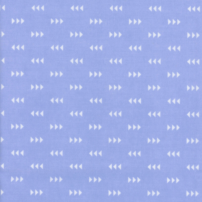 Periwinkle fabric featuring a pattern of white triangles