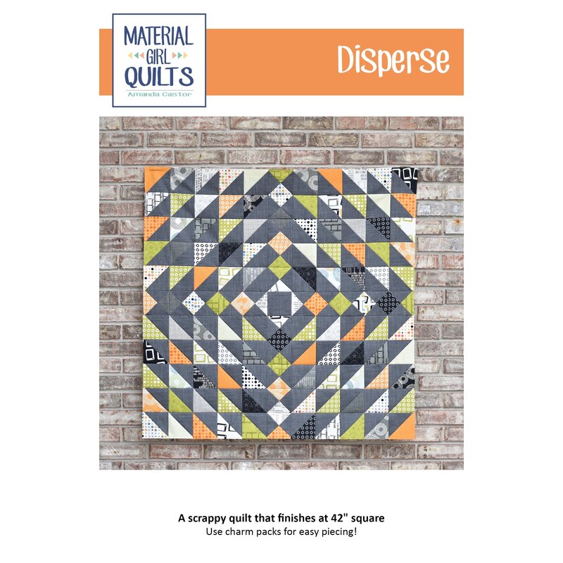 Front cover of pattern, showing the patchwork project without a binding, staged in front of a glazed brick wall.