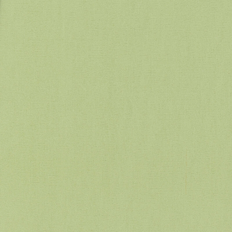Pea green flannel fabric with slightly visible flannel texturing.