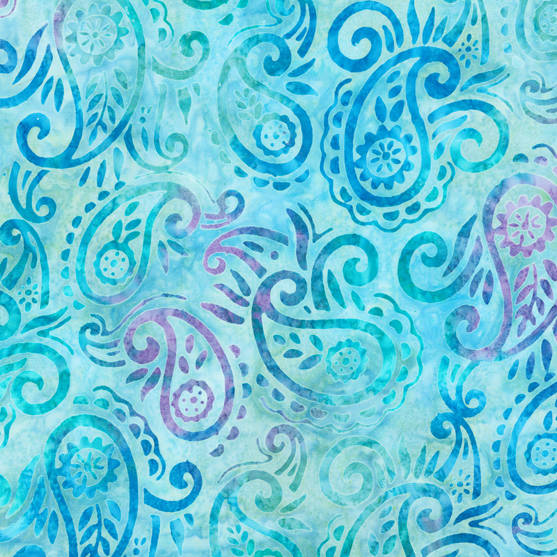 Sky blue mottled batik fabric with dark blue and purple mottled paisleys and scrolls throughout