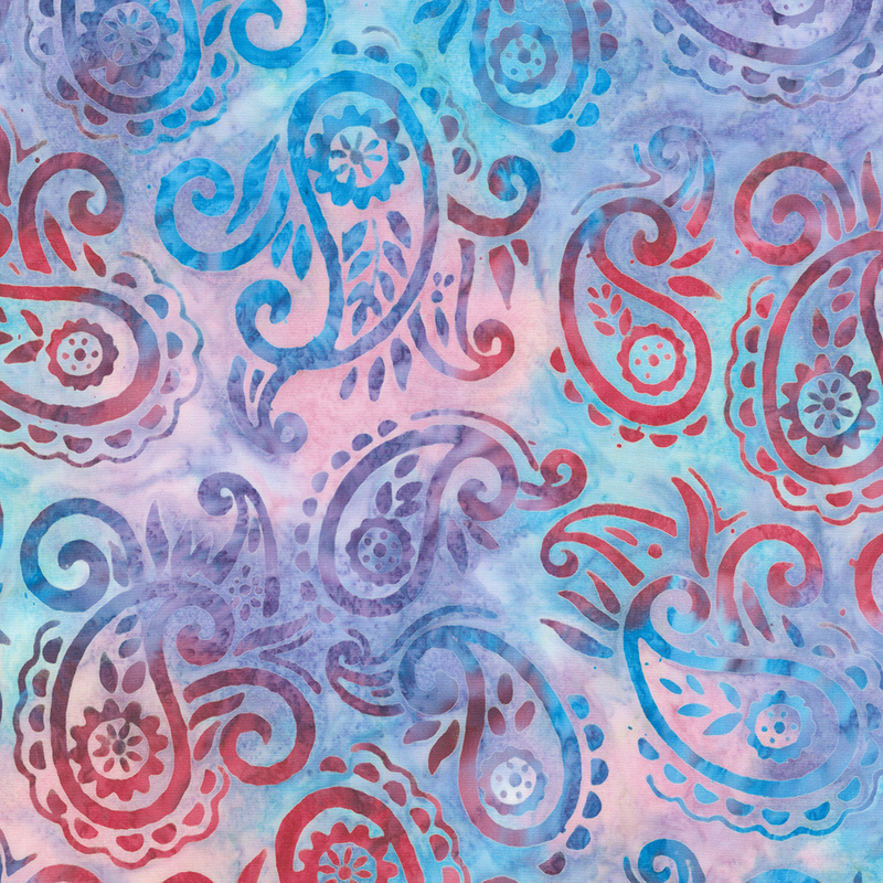 Mottled blue, purple, and pink batik fabric with dark red and blue paisleys and scrolls