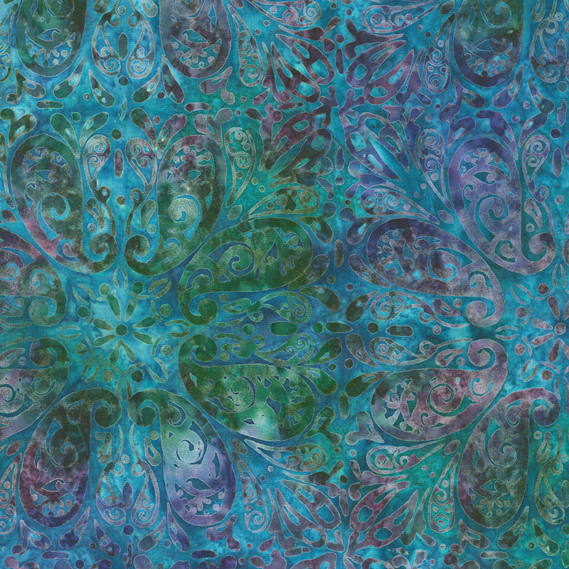 Mottled green, blue, and purple batik fabric with paisleys arranged in a repeating pattern