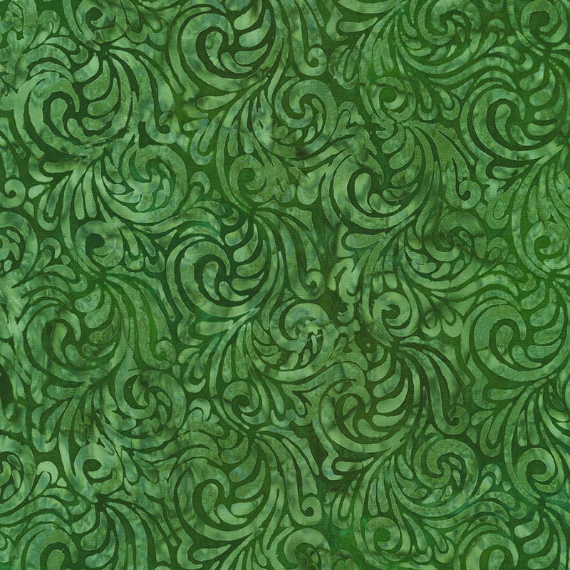 Mottled tonal green batik fabric with paisley scrolls throughout