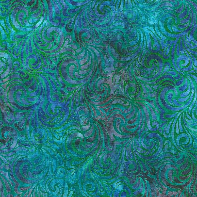 Mottled blue and green batik fabric with paisley scrolls throughout
