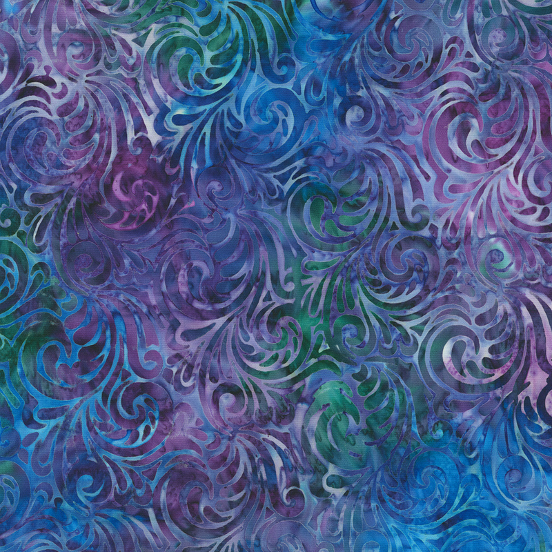 Mottled blue, green, and purple batik fabric with paisley scrolls throughout