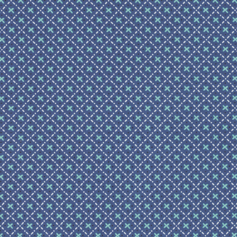 denim blue fabric with scattered x's surrounded by a white dotted and lined lattice design