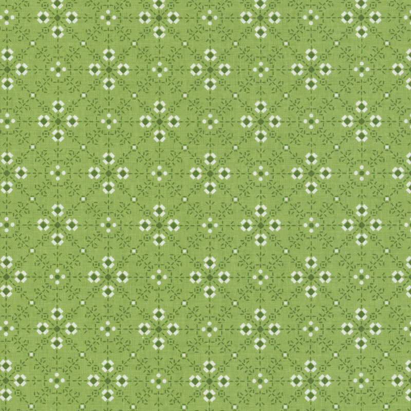 green fabric with a latticed and geometric flower-like design