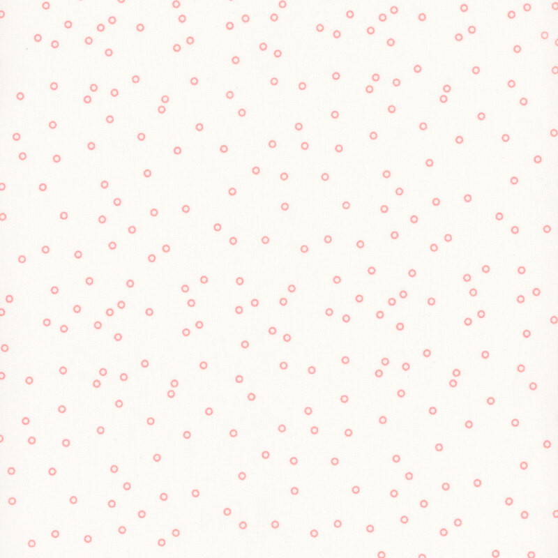 White fabric with scattered coral circle dots.