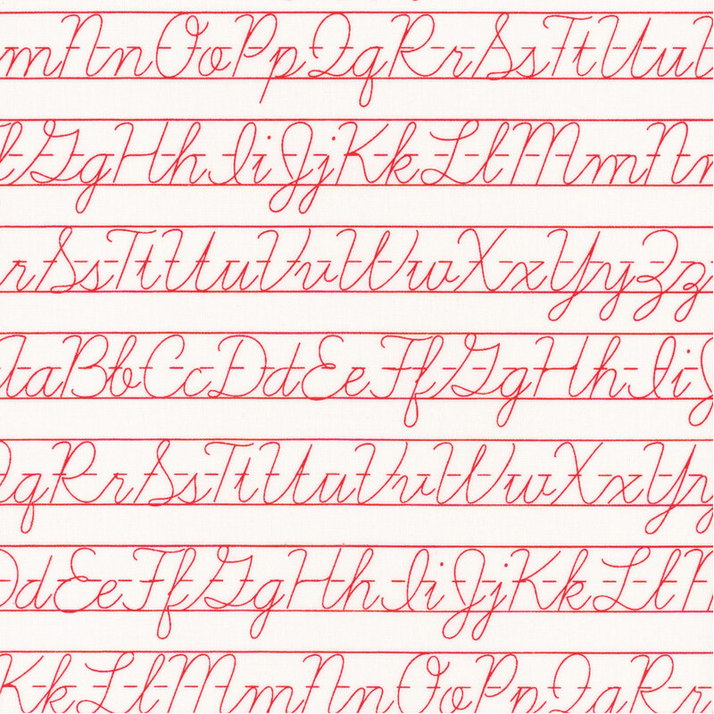 White fabric with red rows of cursive alphabet penmanship practice sheets.