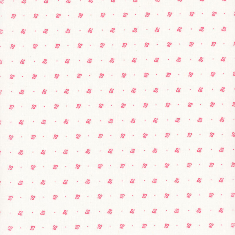 White fabric with rows of light pink clovers and pin dots.