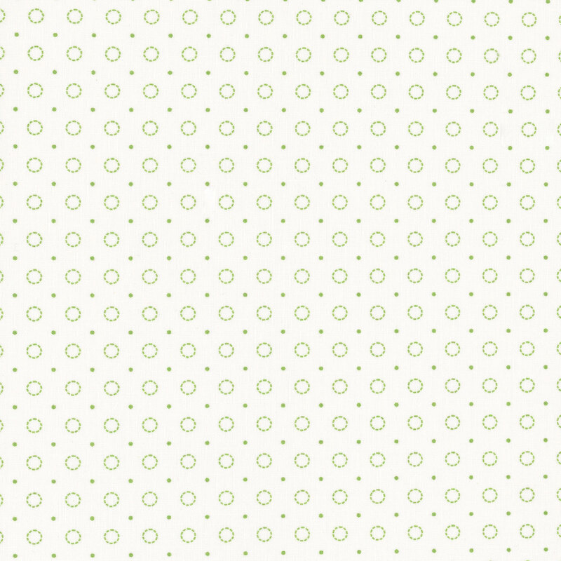 White fabric with alternating rows of green circle dots and pin dots.