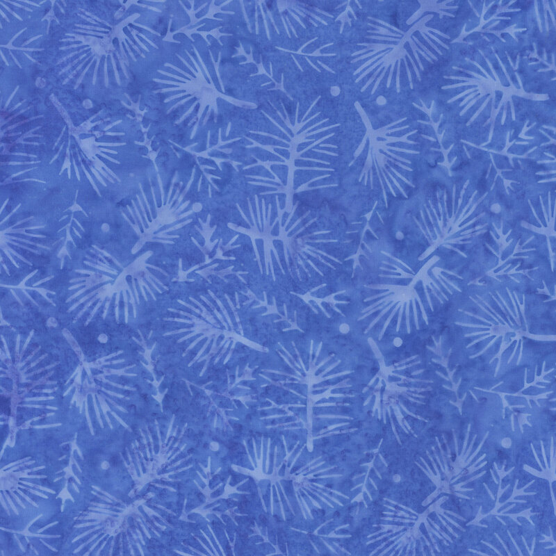 Medium blue mottled batik fabric with lighter blue pine sprigs tossed throughout