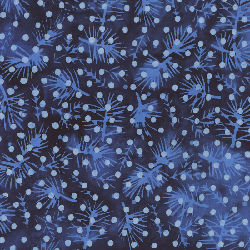 Dark blue batik fabric with lighter blue pine sprigs and polka dots throughout