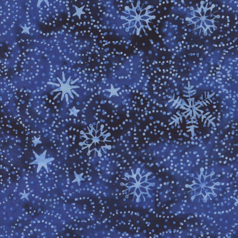 Dark blue mottled batik with lighter blue silhouettes of snowflakes, stars, and dotted swirls