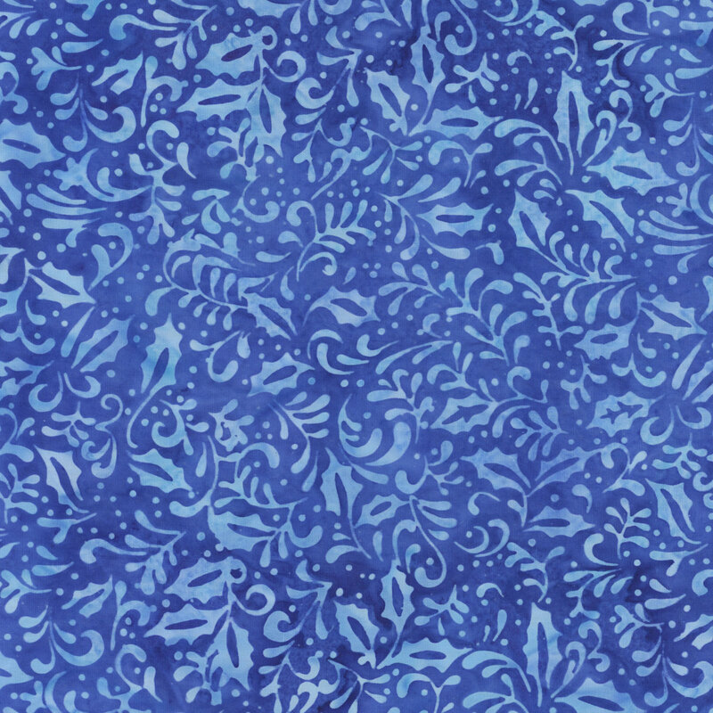 Medium blue tonal batik with lighter blue silhouettes of swirling vines and holly leaves