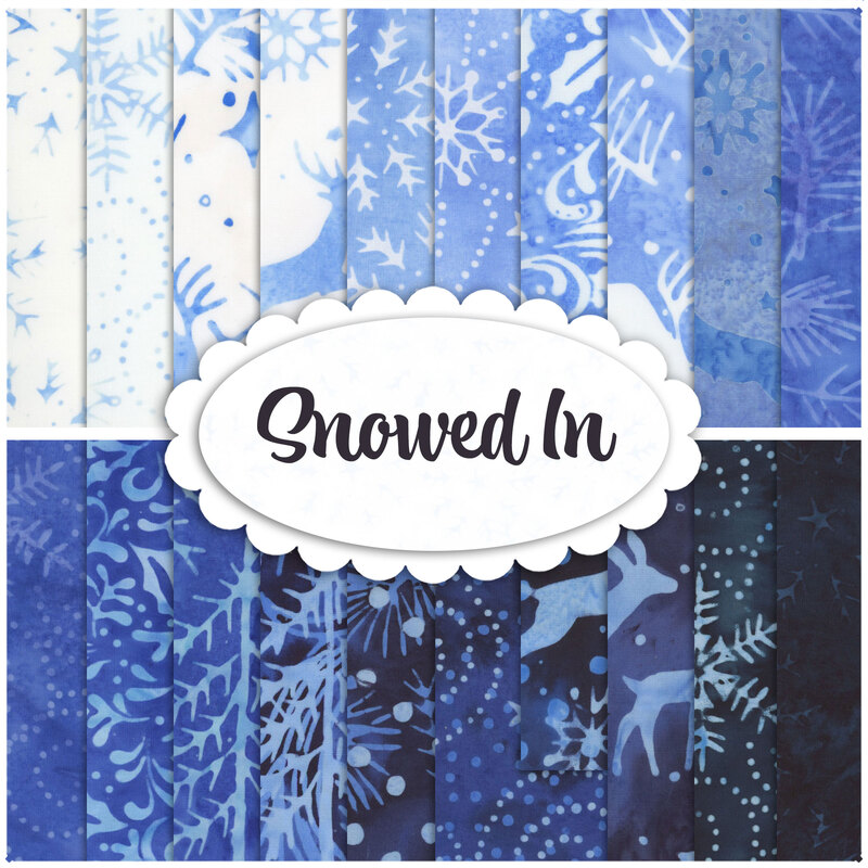 A stacked collage of blue and white mottled batiks with winter motifs