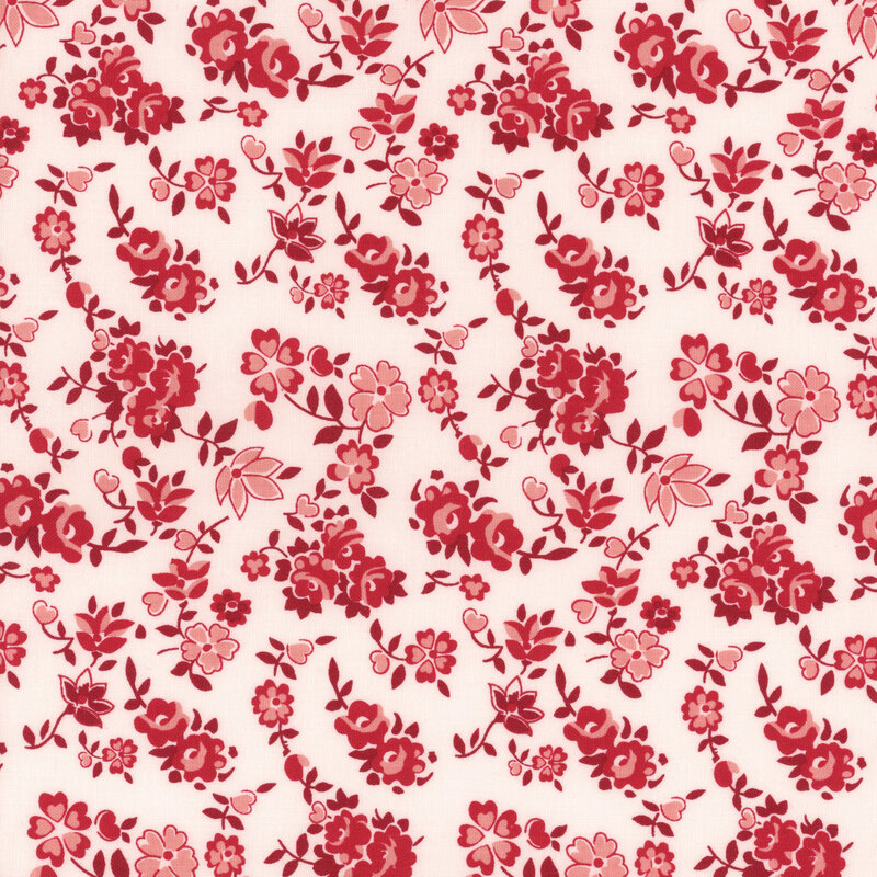 White fabric featuring red and pink florals