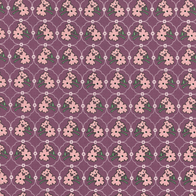 Purple fabric featuring a pink floral medallion design