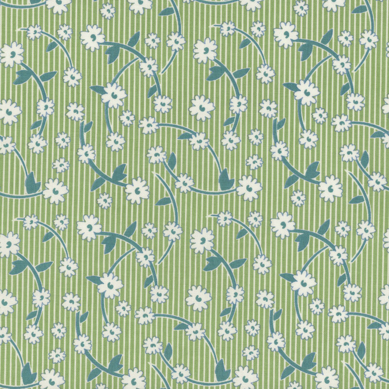 Green and white striped fabric featuring leafy sprigs and white flowers