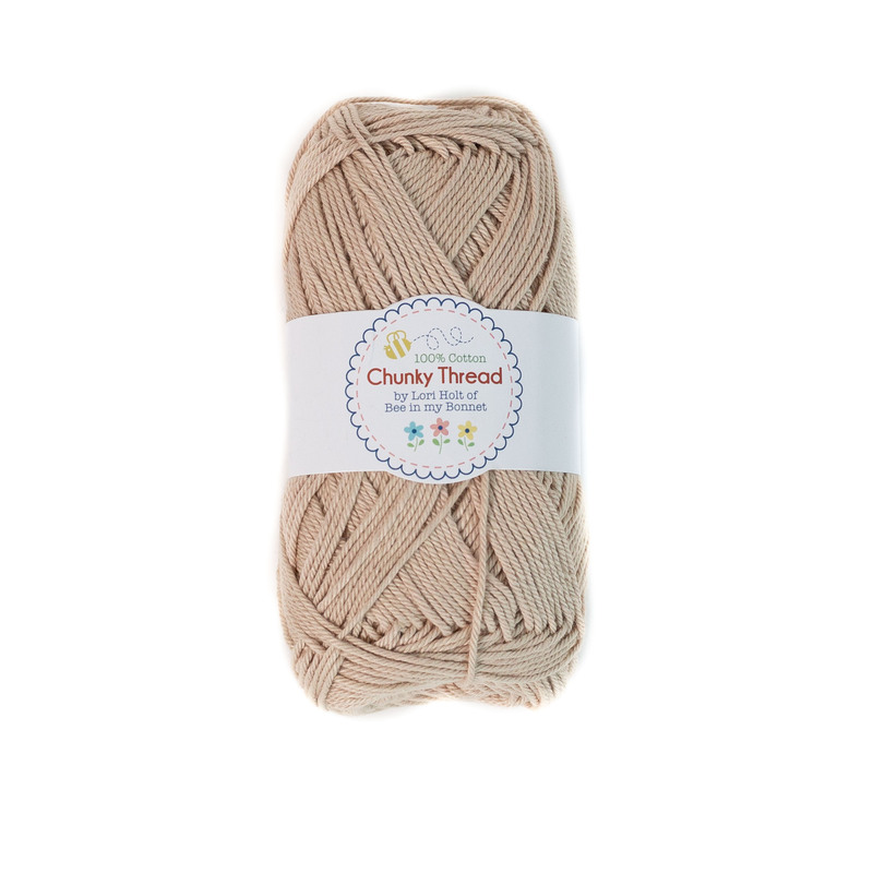 A skein of the Wheat Chunky Thread, isolated on a white background.