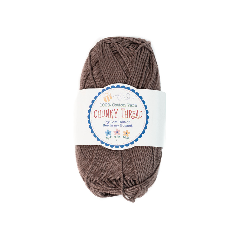 A skein of the Raisin Chunky Thread, isolated on a white background.