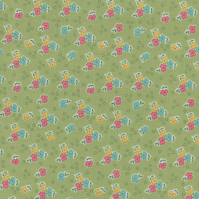 Green fabric featuring scattered squares and clusters of flowers