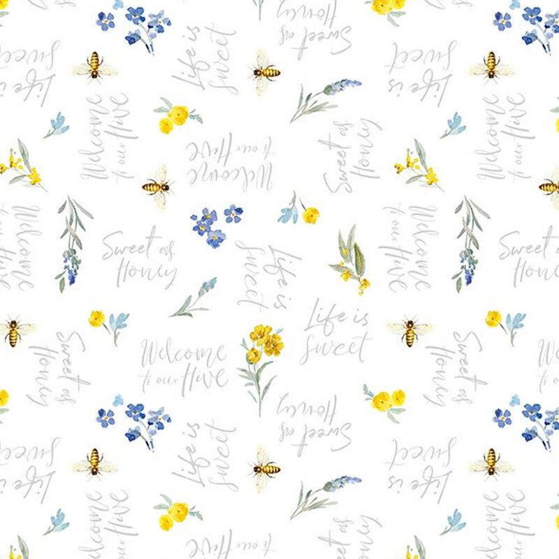 White fabric sayings in script font, flowers, bees, and sprigs scattered throughout