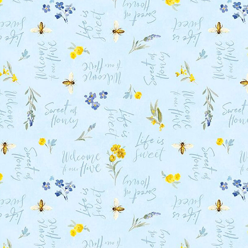 Light baby blue fabric with tossed florals, bees, and phrases in script font.