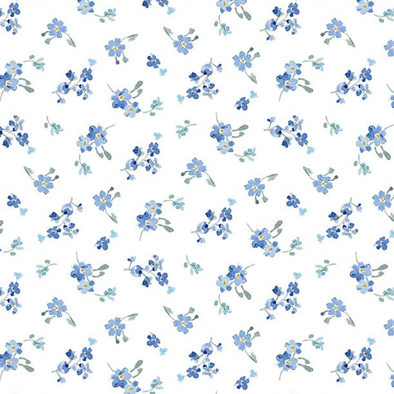 White fabric with tossed blue floral bouquets in a ditsy pattern