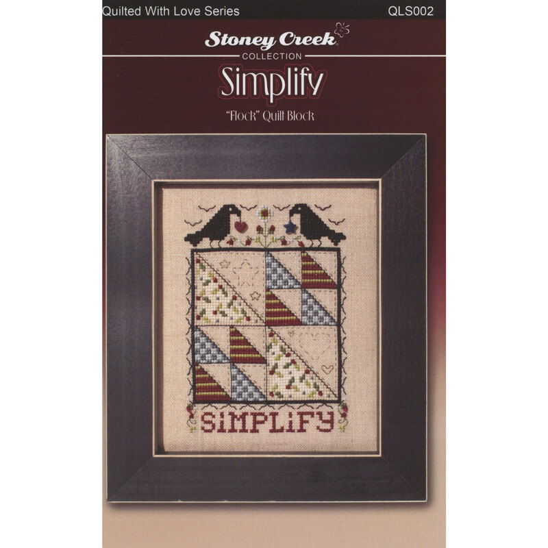 Front of cross stitch pattern showing the finished design displayed in a frame