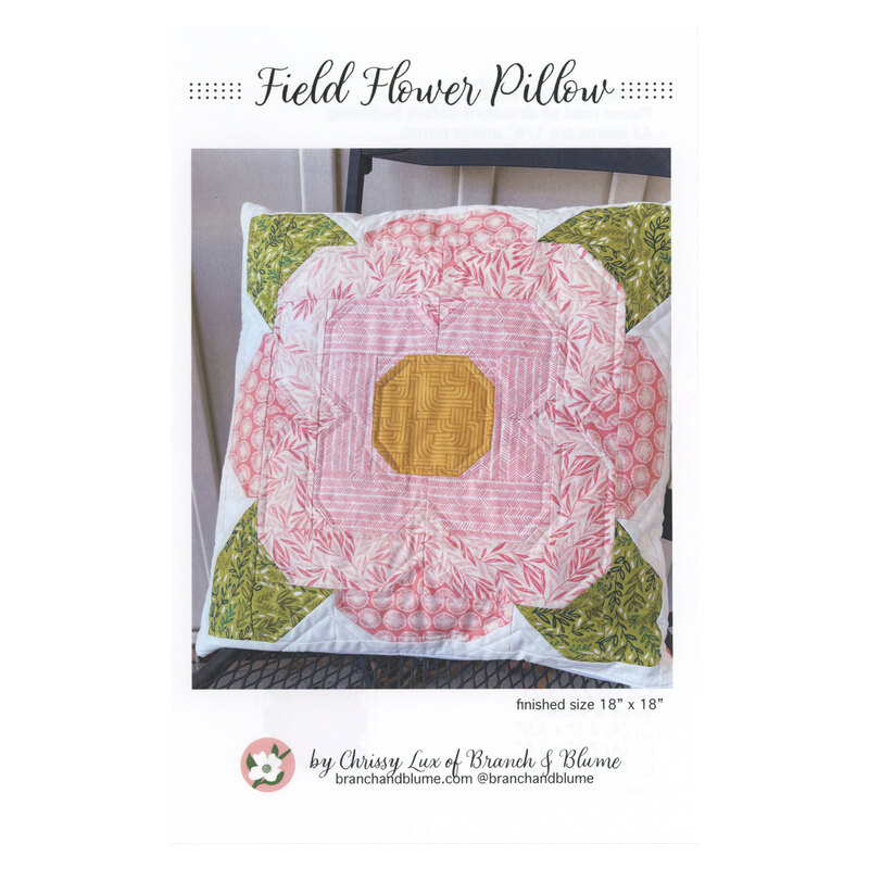 Front of Field Flower Pillow pattern showing the finished pillow staged on a table.