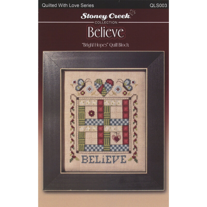 Front of cross stitch pattern showing the finished design displayed in a frame
