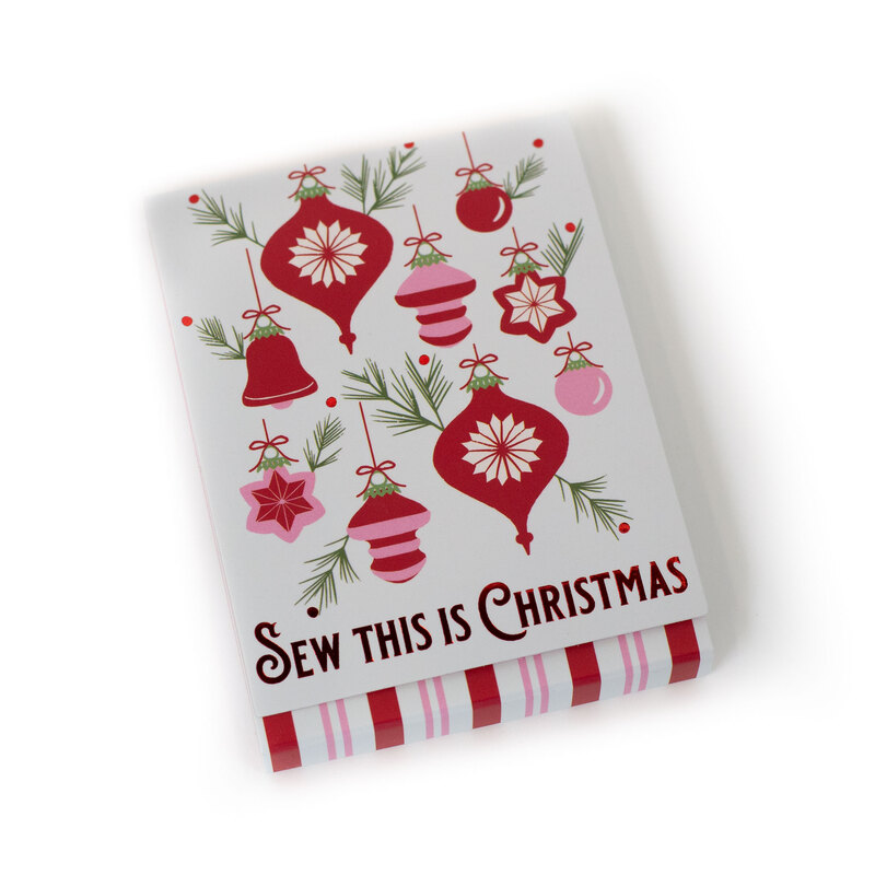 Closed Sew This Is Christmas Notepad on a white background.
