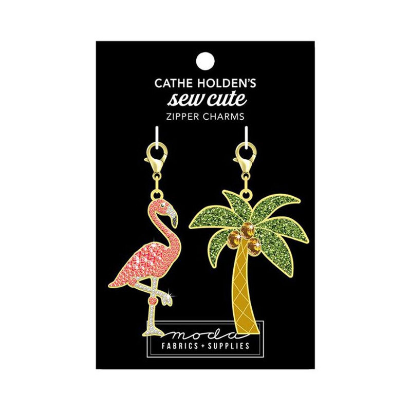 A black tag with a pink flamingo and a palm tree zip pull