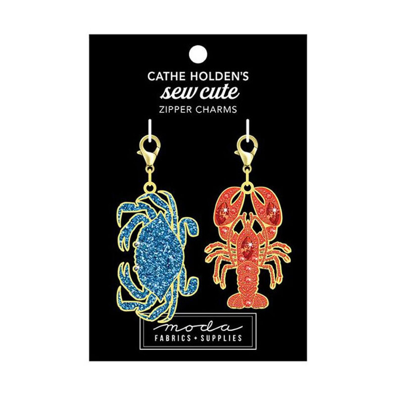 A black tag with a blue crab and a red lobster zip pull