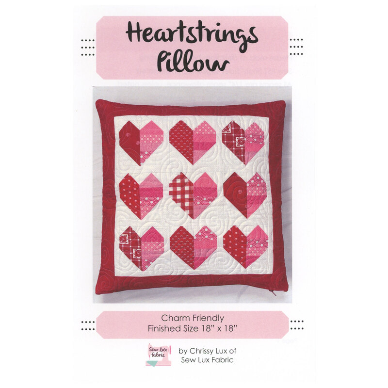 Front cover of the Heartstrings Pillow pattern showing the finished pillow isolated on a white background.