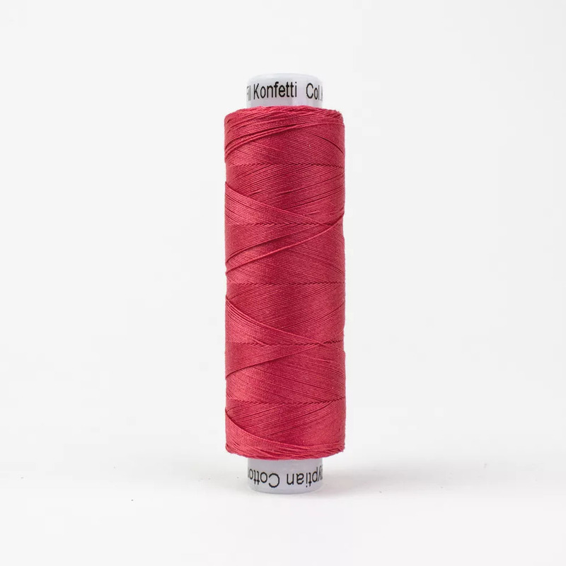 Spool of KT312 Lip Gloss thread, isolated on a white background