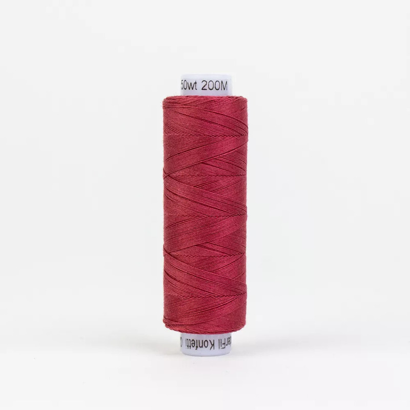 Spool of KT305 Dark Rose thread, isolated on a white background
